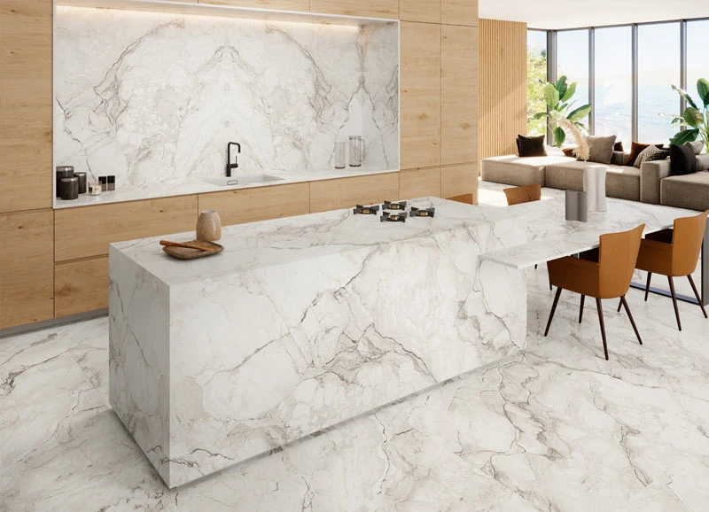 Coverlam inspiration: a light veined kitchen island, wall and floor with warm timber cabinetry.